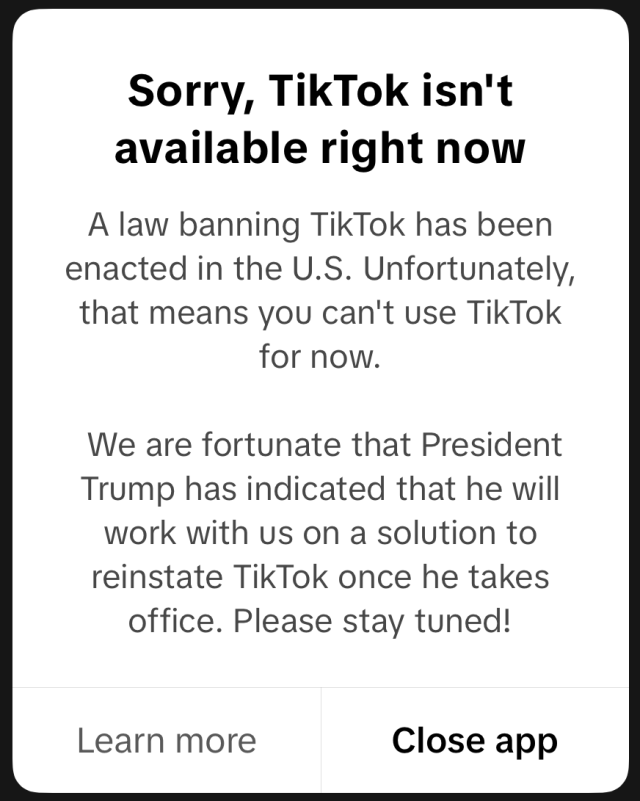 Tiktok Ban Us Capitol TikTok app icon displayed on a smartphone screen with a blurred background of American flags
