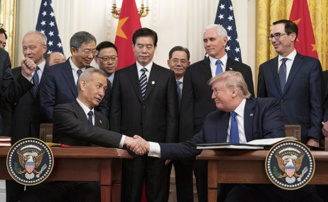 Us China Phase 1 Trade Deal Signing US Treasury Secretary Steven Mnuchin and China's Vice Premier Liu He shaking hands at a signing ceremony in Washington, DC.