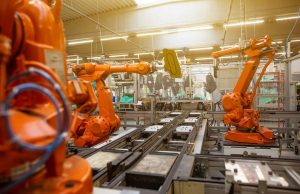 DeepMind Restricts New Robotics Models to 4 Partners A robotic arm with a gripper approaches a cup on a table, demonstrating embodied reasoning in a controlled testing environment.