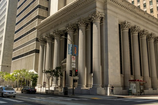HSBC’s 2012 Drug-Money Scandal Still Defines Global Banking Fault Lines HSBC bank building exterior with security cameras and compliance signage visible
