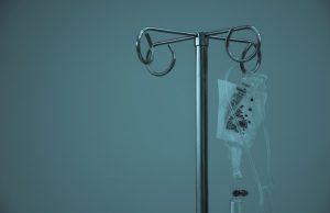 EU Approves Dual-Antibody Melanoma Drug Opdualag A medical professional holds an intravenous infusion bag labeled Opdualag in a clinical setting.