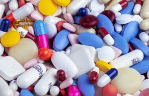 Israeli Researchers Propose Losartan for COVID-19 Researchers in a lab discussing a blood pressure drug as a potential treatment for COVID-19.