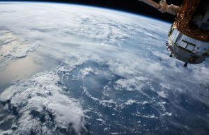 Gemini 7 Astronaut Borman Reported UAP Sighting in 1965 Astronaut Frank Borman in Gemini 7 spacesuit during 1965 mission, with transcript document showing UFO sighting annotation