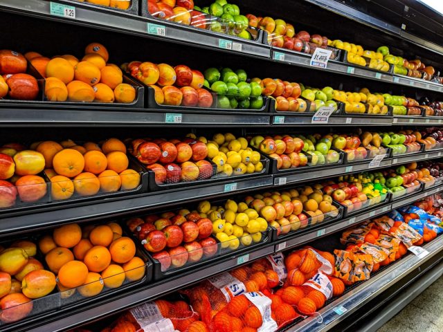 UN food price index rises for 12th straight month to highest since 2011 Rows of wheat stalks under a cloudy sky, symbolizing rising cereal costs worldwide.