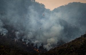 LA Wildfire Laser Claims Persist Despite Debunking Smoke rises over a Los Angeles neighborhood as residents survey fire damage and ash-covered debris.