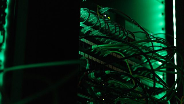 OpenAI's evolution from nonprofit to AI powerhouse with ChatGPT launch OpenAI logo on a dark background with ChatGPT interface displayed on a screen