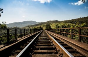 Bohumín Train Crash Kills One, Injures 19 A damaged train at a level crossing in Bohumín, with emergency responders and debris scattered near the tracks.