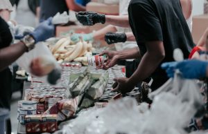 Recife Church Roof Collapse Kills Two, Halts Food Hub Emergency workers stand amid debris of a collapsed church roof in Recife, Brazil, with food distribution supplies scattered nearby.