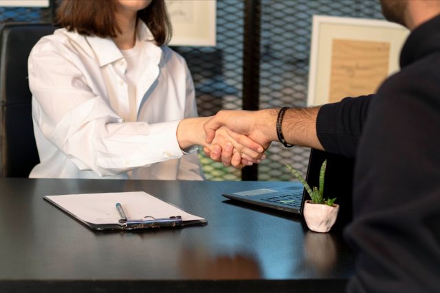 AmBank and PUMM Pact Guarantees Five-Day Loan Reviews for SMEs Bank officers and PUMM leaders shake hands over signed loan-speed pact papers in Kuala Lumpur boardroom.