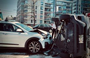 12 Killed in Balochistan Road Accidents A damaged road in Balochistan with a truck carrying dates, illustrating the region's infrastructure challenges.