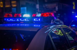 Philippines Cliff Crash Kills 5 Security Personnel A police vehicle lies wrecked at the bottom of a steep cliff in Don Victoriano, Misamis Occidental, surrounded by rescue personnel and debris.