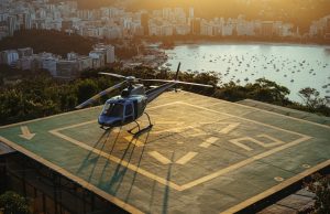 Helicopter Crash Kills 3 on Remote Kauaʻi Beach Rescue helicopter hovering over remote Kalalau Beach surrounded by lush valleys and towering sea cliffs