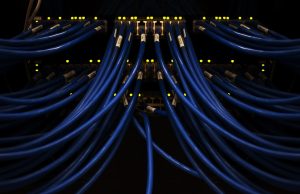 Scale AI Founder Alexandr Wang Leaves to Head Meta Alexandr Wang stands before a glowing server rack marked Meta, symbolizing his move to lead the superintelligence lab.