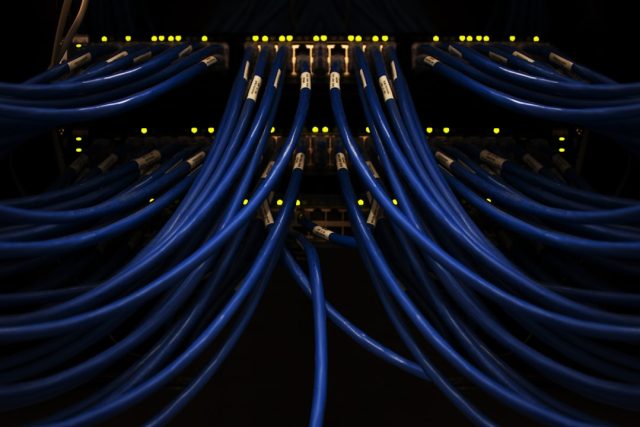 Meta Names Scale AI Founder to Lead New Superintelligence Lab Alexandr Wang stands before a glowing server rack marked Meta, symbolizing his move to lead the superintelligence lab.
